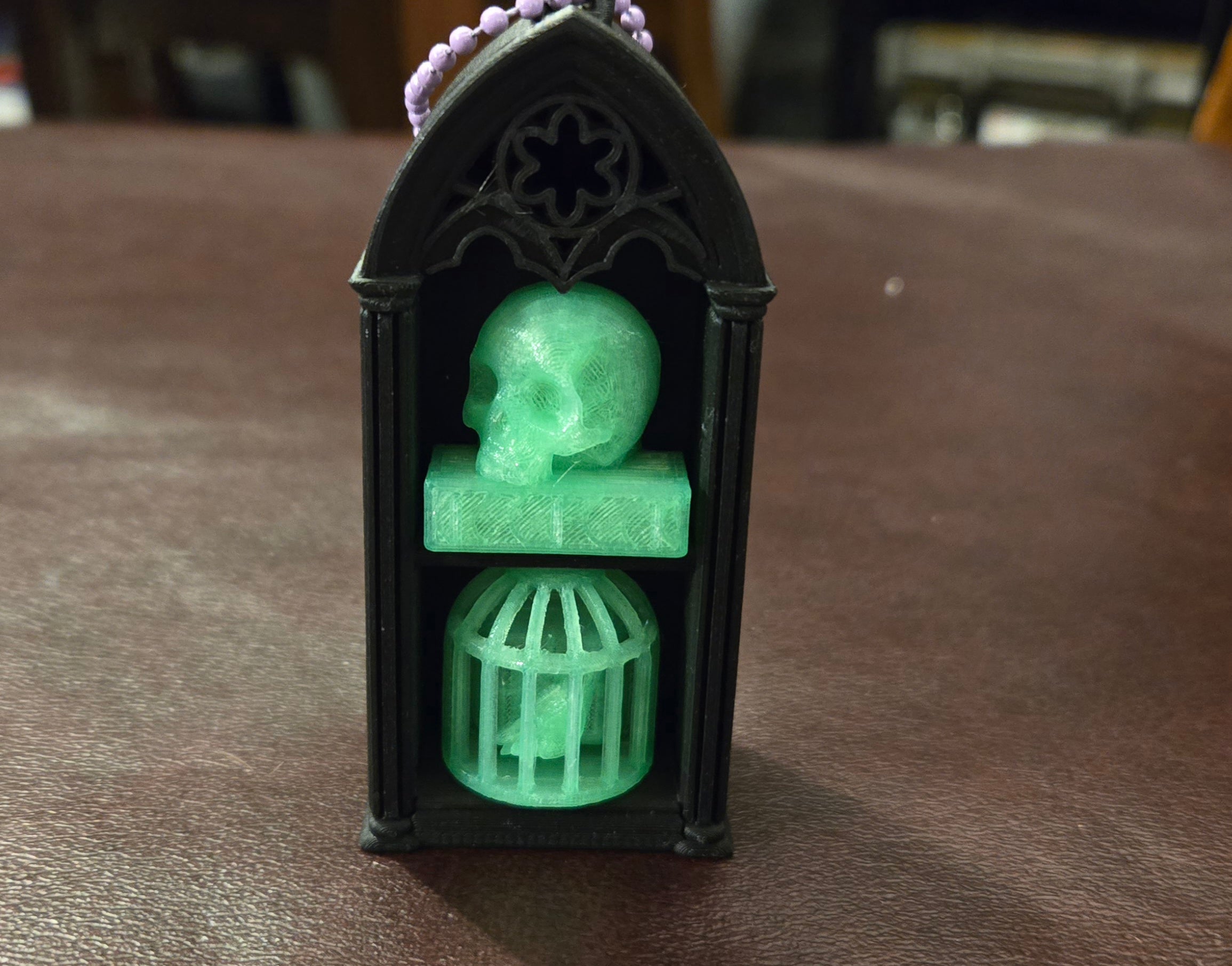 Black double shelf glow skull book and bird
